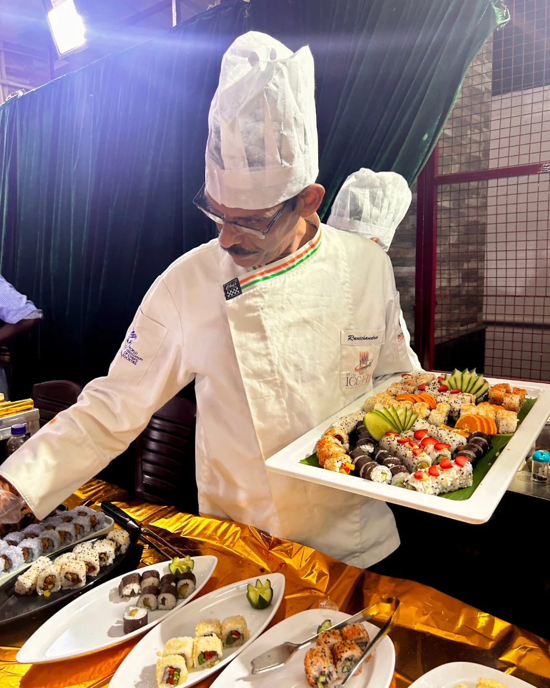 Chef AVR serving premium sushi platter